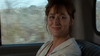 Movie still from “The Bridges of Madison County” (1995), directed by Clint Eastwood – A person sitting in a car; Close Up shot, Over the shoulder angle