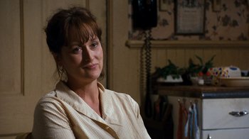 Movie still from “The Bridges of Madison County” (1995), directed by Clint Eastwood – A person sitting in a room; Close Up shot, Over the shoulder angle