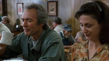 Movie still from “The Bridges of Madison County” (1995), directed by Clint Eastwood – A man and a woman sitting at a table in a restaurant; Close Up shot, Over the shoulder angle