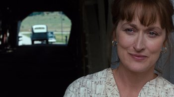 Movie still from “The Bridges of Madison County” (1995), directed by Clint Eastwood – A person wearing a white shirt; Close Up shot, Over the shoulder angle
