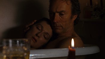 Movie still from “The Bridges of Madison County” (1995), directed by Clint Eastwood – A man and a woman in a bath tub next to a lit candle; Close Up shot, High angle
