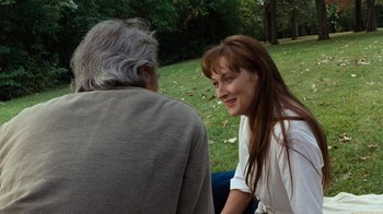 Movie still from “The Bridges of Madison County” (1995), directed by Clint Eastwood – An older man sitting next to a woman in a park; Close Up shot, Over the shoulder angle