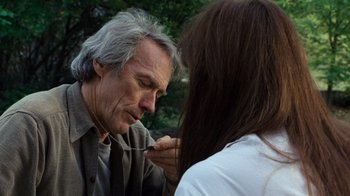 Movie still from “The Bridges of Madison County” (1995), directed by Clint Eastwood – An older man and a young woman looking at each other; Close Up shot, Over the shoulder angle