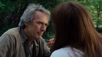 Movie still from “The Bridges of Madison County” (1995), directed by Clint Eastwood – An older man and a young woman looking at each other; Close Up shot, Over the shoulder angle