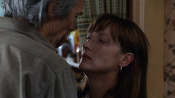 Movie still from “The Bridges of Madison County” (1995), directed by Clint Eastwood – An older man and a younger woman face to face; Close Up shot, Over the shoulder angle