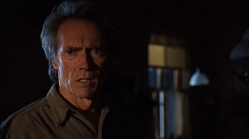 Movie still from “The Bridges of Madison County” (1995), directed by Clint Eastwood – An old man with a long white hair is looking at the camera; Close Up shot, Low angle