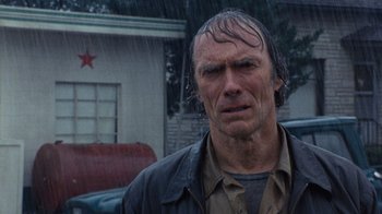 Movie still from “The Bridges of Madison County” (1995), directed by Clint Eastwood – A person with wet hair; Close Up shot, Low angle