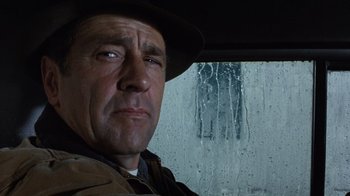 Movie still from “The Bridges of Madison County” (1995), directed by Clint Eastwood – A person in a car near a window; Close Up shot, Low angle