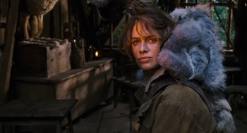 Movie still from “The Brothers Grimm” (2005), directed by Terry Gilliam – A woman is standing in front of an outdoor setting; Close Up shot, Over the shoulder angle