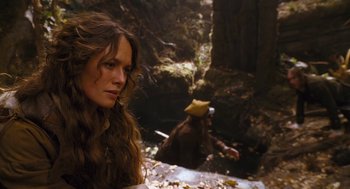 Movie still from “The Brothers Grimm” (2005), directed by Terry Gilliam – A woman with long brown hair in a forest; Medium shot, Over the shoulder angle