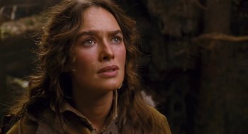 Movie still from “The Brothers Grimm” (2005), directed by Terry Gilliam – A person with long brown hair; Close Up shot, Over the shoulder angle