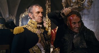 Movie still from “The Brothers Grimm” (2005), directed by Terry Gilliam – Two men dressed up in costumes and makeup; Close Up shot, Over the shoulder angle