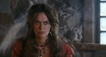 Movie still from “The Brothers Grimm” (2005), directed by Terry Gilliam – A person with long brown hair; Close Up shot, Over the shoulder angle