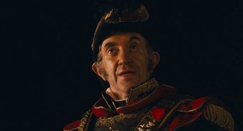 Movie still from “The Brothers Grimm” (2005), directed by Terry Gilliam – A person wearing a hat; Close Up shot, High angle