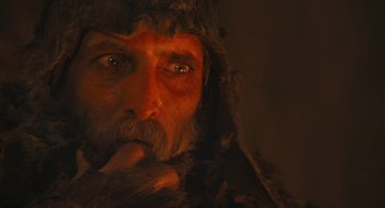 Movie still from “The Brothers Grimm” (2005), directed by Terry Gilliam – A person wearing a fur coat; Close Up shot, Low angle