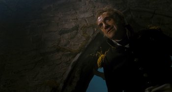 Movie still from “The Brothers Grimm” (2005), directed by Terry Gilliam – A man in a scuba suit looking up at the sky; Medium shot, Low angle