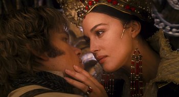 Movie still from “The Brothers Grimm” (2005), directed by Terry Gilliam – A man and a woman are kissing each other; Close Up shot, Over the shoulder angle