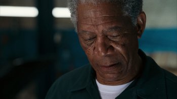 Movie still from “The Bucket List” (2007), directed by Rob Reiner – An older man is looking down at his face; Close Up shot, Low angle