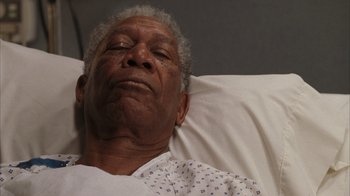 Movie still from “The Bucket List” (2007), directed by Rob Reiner – An older man laying in a hospital bed; Close Up shot, High angle