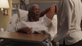 Movie still from “The Bucket List” (2007), directed by Rob Reiner – An older man laying in a hospital bed; Medium shot, High angle