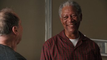 Movie still from “The Bucket List” (2007), directed by Rob Reiner – An older man smiles for the camera; Close Up shot, Low angle