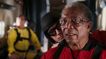 Movie still from “The Bucket List” (2007), directed by Rob Reiner – An older man in a red shirt and a woman in a yellow jacket; Close Up shot, Over the shoulder angle
