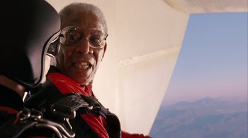 Movie still from “The Bucket List” (2007), directed by Rob Reiner – An older man in a red shirt is in a plane; Close Up shot, Over the shoulder angle