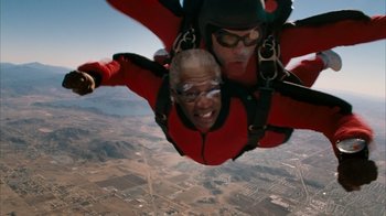 Movie still from “The Bucket List” (2007), directed by Rob Reiner – Two people are parachuting in the air; Close Up shot, Overhead angle