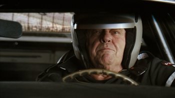 Movie still from “The Bucket List” (2007), directed by Rob Reiner – An older man wearing a helmet in a car; Close Up shot, Low angle