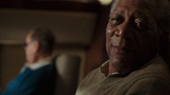 Movie still from “The Bucket List” (2007), directed by Rob Reiner – An older man sitting in front of another older man; Close Up shot, Low angle