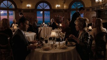 Movie still from “The Bucket List” (2007), directed by Rob Reiner – A group of people sitting at a table in front of a window; Wide shot, High angle