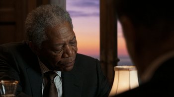 Movie still from “The Bucket List” (2007), directed by Rob Reiner – An older man wearing a suit and tie; Close Up shot, Over the shoulder angle