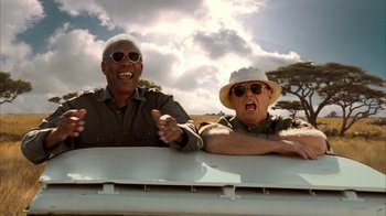 Movie still from “The Bucket List” (2007), directed by Rob Reiner – Two men are sitting in the back of a truck; Medium shot, Low angle