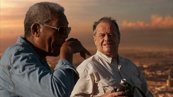 Movie still from “The Bucket List” (2007), directed by Rob Reiner – Two older men standing next to each other on a hill; Close Up shot, Low angle