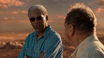 Movie still from “The Bucket List” (2007), directed by Rob Reiner – Two older men are talking in front of a sunset; Close Up shot, Over the shoulder angle