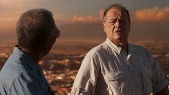 Movie still from “The Bucket List” (2007), directed by Rob Reiner – Two older men standing next to each other on top of a hill; Close Up shot, Over the shoulder angle