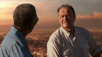Movie still from “The Bucket List” (2007), directed by Rob Reiner – Two older men are standing in front of a sky background; Close Up shot, Over the shoulder angle