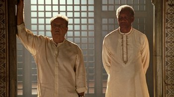 Movie still from “The Bucket List” (2007), directed by Rob Reiner – Two men standing next to each other wearing white shirts; Medium shot, Low angle