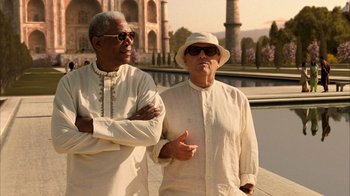 Movie still from “The Bucket List” (2007), directed by Rob Reiner – Two older men standing next to each other in front of a building; Medium shot, Over the shoulder angle