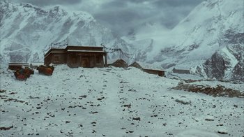 Movie still from “The Bucket List” (2007), directed by Rob Reiner – An abandoned building in the middle of a snowy field; Extreme Wide shot, High angle