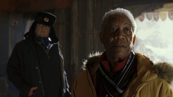 Movie still from “The Bucket List” (2007), directed by Rob Reiner – A man in a coat and hat standing next to another man in a hat; Close Up shot, Low angle