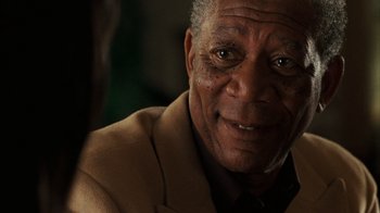 Movie still from “The Bucket List” (2007), directed by Rob Reiner – An older man wearing a suit and tie; Close Up shot, Over the shoulder angle
