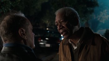 Movie still from “The Bucket List” (2007), directed by Rob Reiner – An older man and a younger woman are talking outside at night; Close Up shot, Over the shoulder angle
