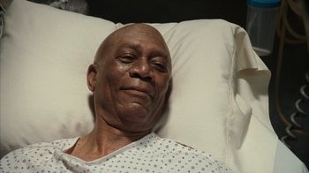 Movie still from “The Bucket List” (2007), directed by Rob Reiner – An older man laying in a hospital bed; Close Up shot, High angle