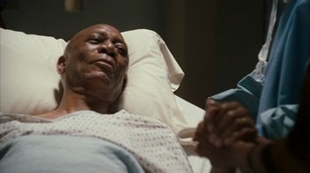 Movie still from “The Bucket List” (2007), directed by Rob Reiner – An older man laying in a hospital bed; Close Up shot, High angle