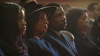 Movie still from “The Bucket List” (2007), directed by Rob Reiner – A group of people sitting next to each other; Close Up shot, High angle