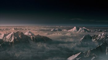 Movie still from “The Bucket List” (2007), directed by Rob Reiner – A view of a mountain range from above the clouds; Extreme Wide shot, High angle