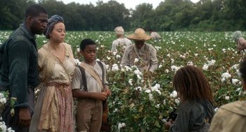 Movie still from “The Butler” (2013), directed by Lee Daniels – A group of people standing in a field of cotton; Medium shot, High angle