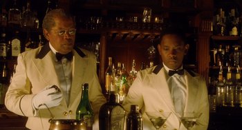 Movie still from “The Butler” (2013), directed by Lee Daniels – Two men are sitting at a bar with drinks; Medium shot, Low angle