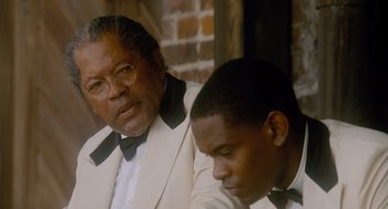 Movie still from “The Butler” (2013), directed by Lee Daniels – A man and a young man in a suit and tie; Close Up shot, Over the shoulder angle